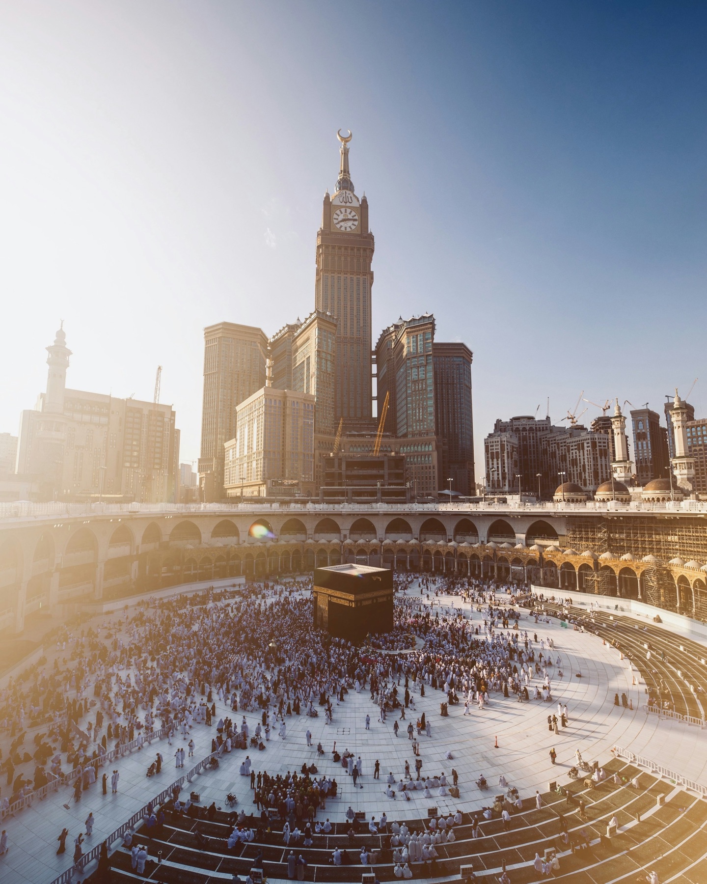 The Kaaba and Makkah clock tower in warm sunlight